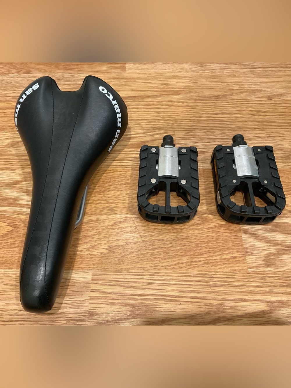 Black Bike Saddle with Black Pedals